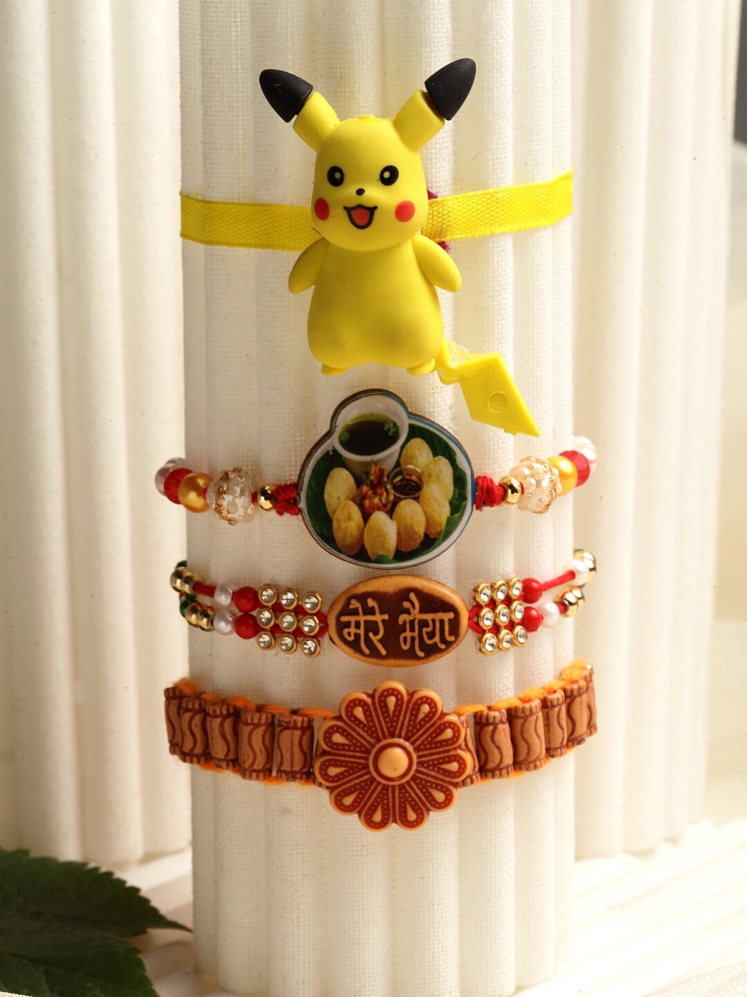 

PANASH Set Of 4 Pikachu & Floral Fancy Rakhis, Multi