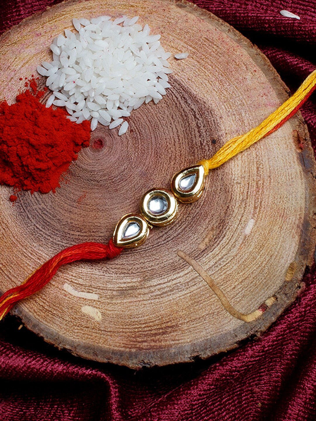 

Shoshaa Gold-Toned & Yellow Kundan Bhai Rakhi