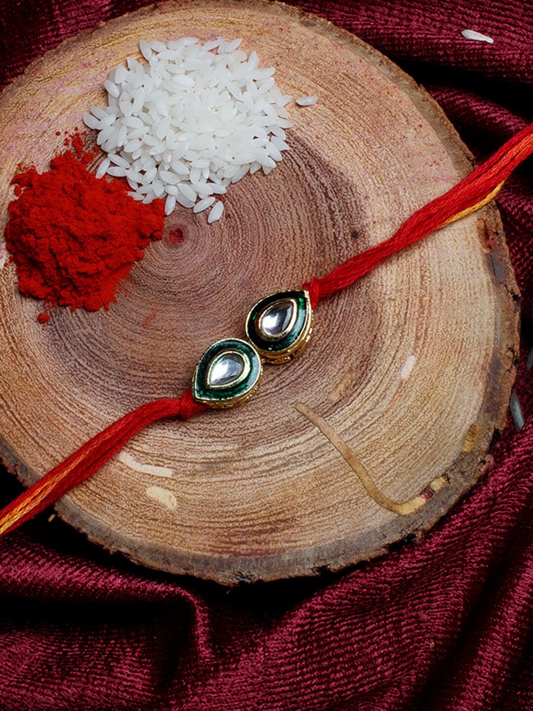 

Shoshaa Gold-Plated Handcrafted Kundan Red Thread Single Bhai Rakhi