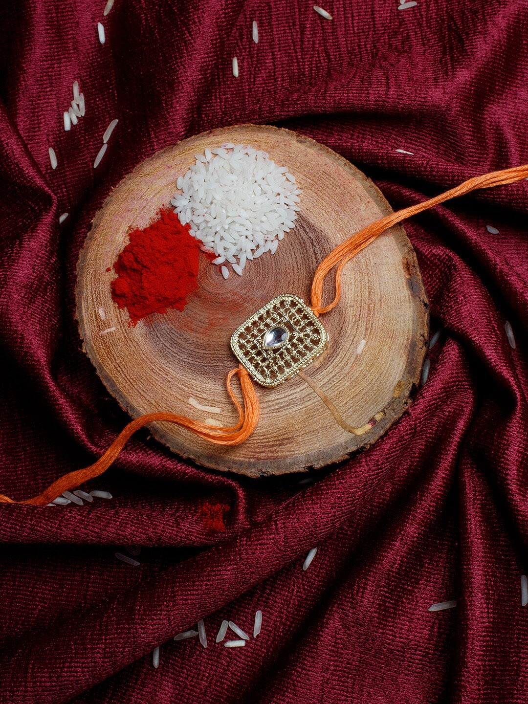 

Shoshaa Gold-Toned & Orange Kundan Studded Bhai Rakhi