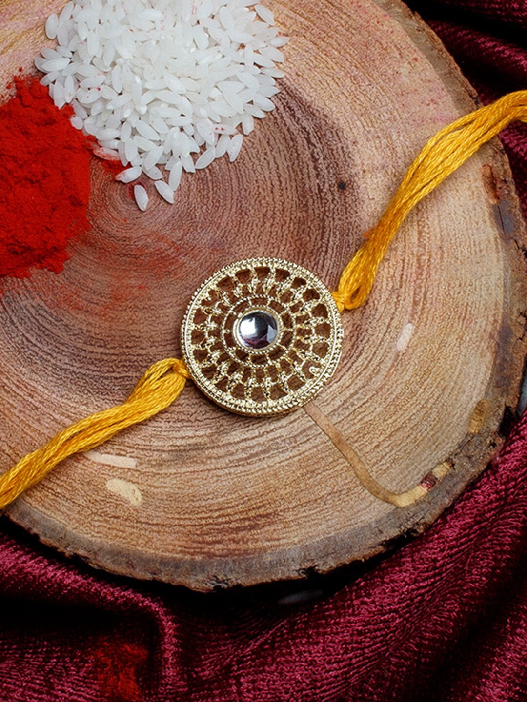 

Shoshaa Gold-Toned & Yellow Kundan Studded Bhai Rakhi