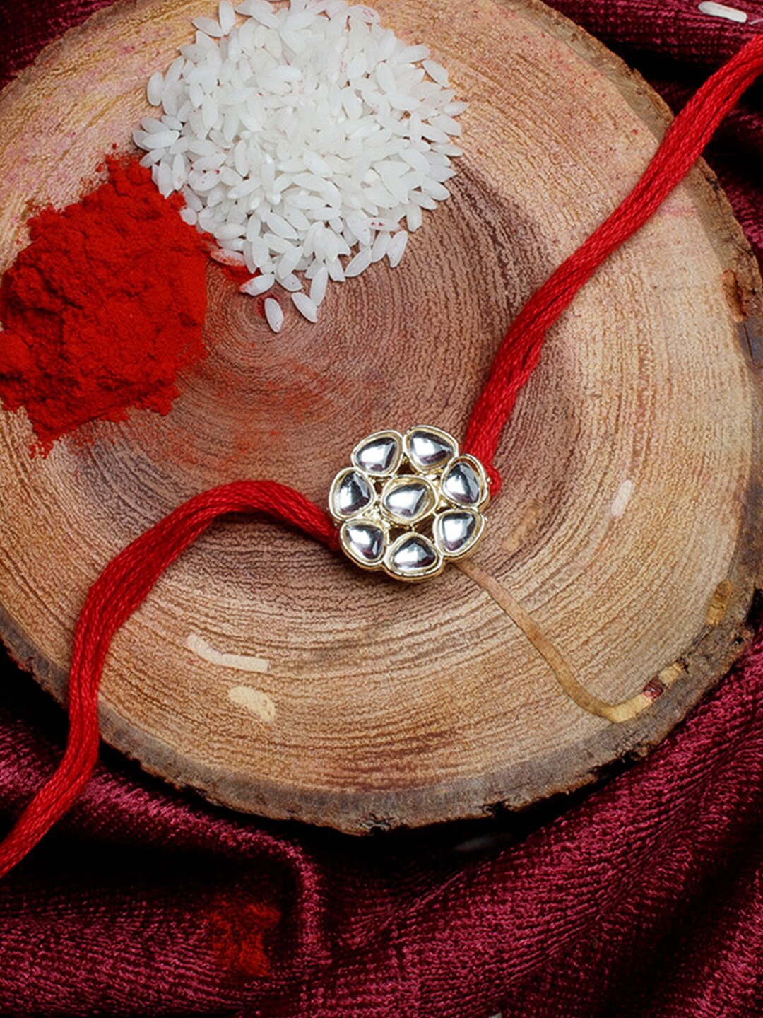 

Shoshaa Gold-Toned & Red Kundan Studded Bhai Rakhi