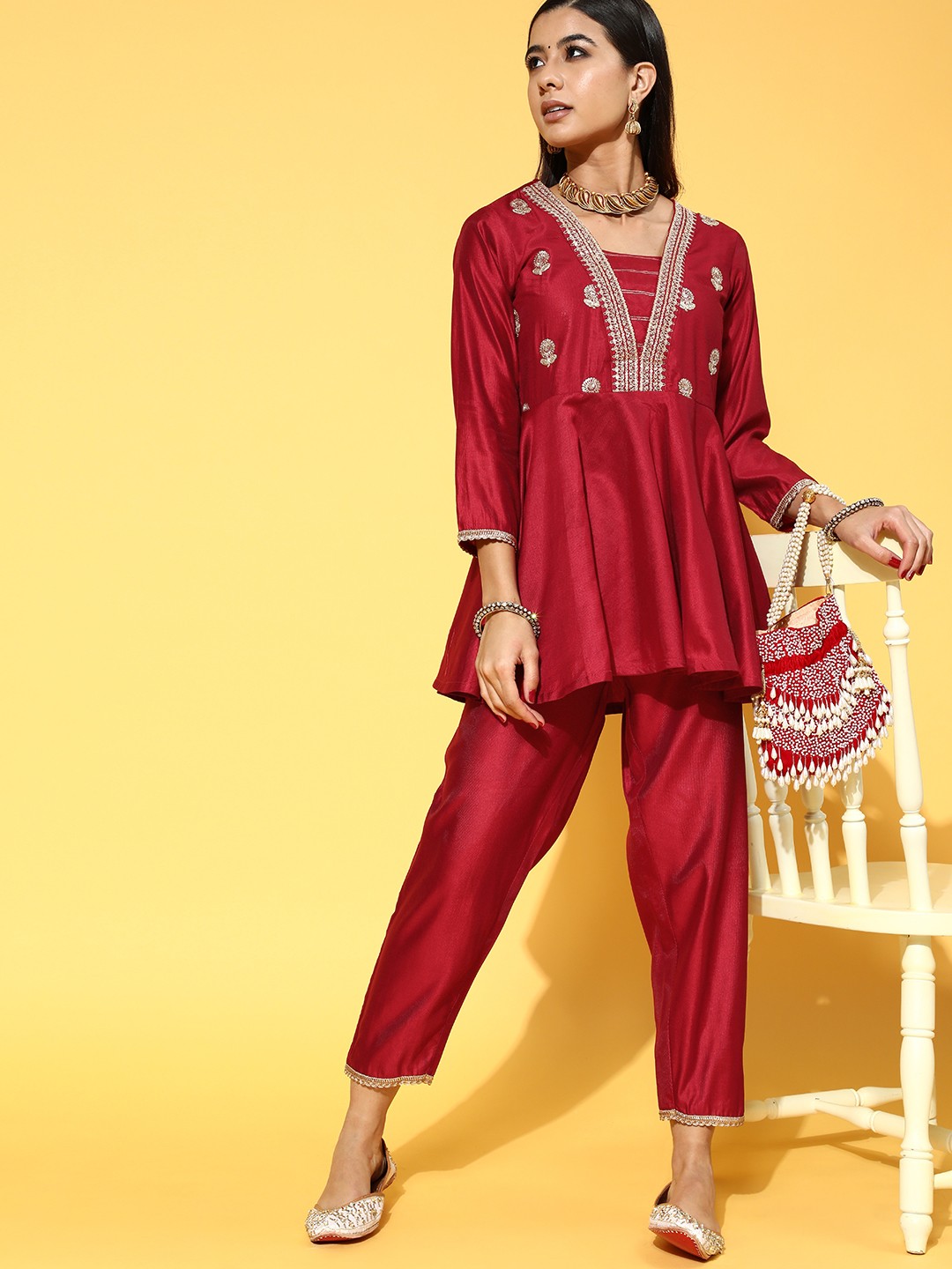 

Indo Era Chic Red Yoke Design Kurti with Solid Trousers