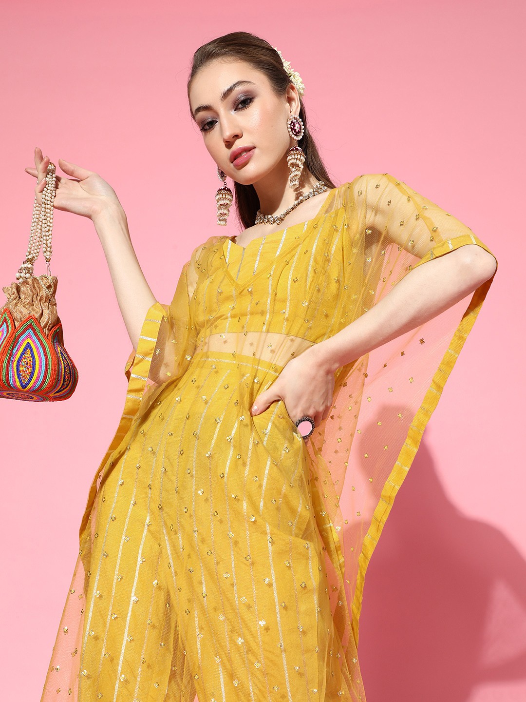 

Inddus Women Stylish Mustard Embellished Top with Striped Trousers