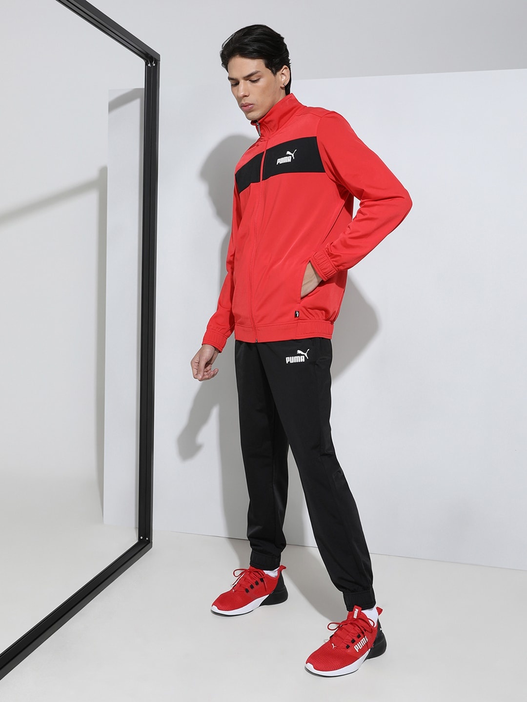 

Puma Men Red & Black Solid Sustainable Track Suit