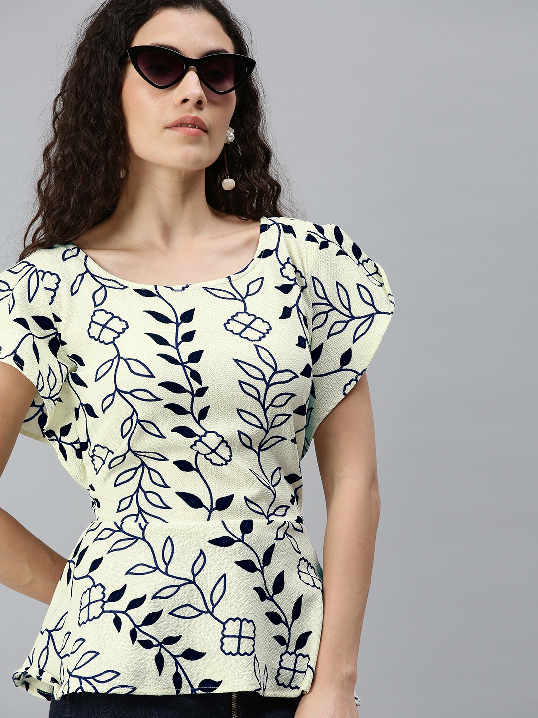 

Campus Sutra Yellow and Blue Pure Cotton Floral Peplum Top