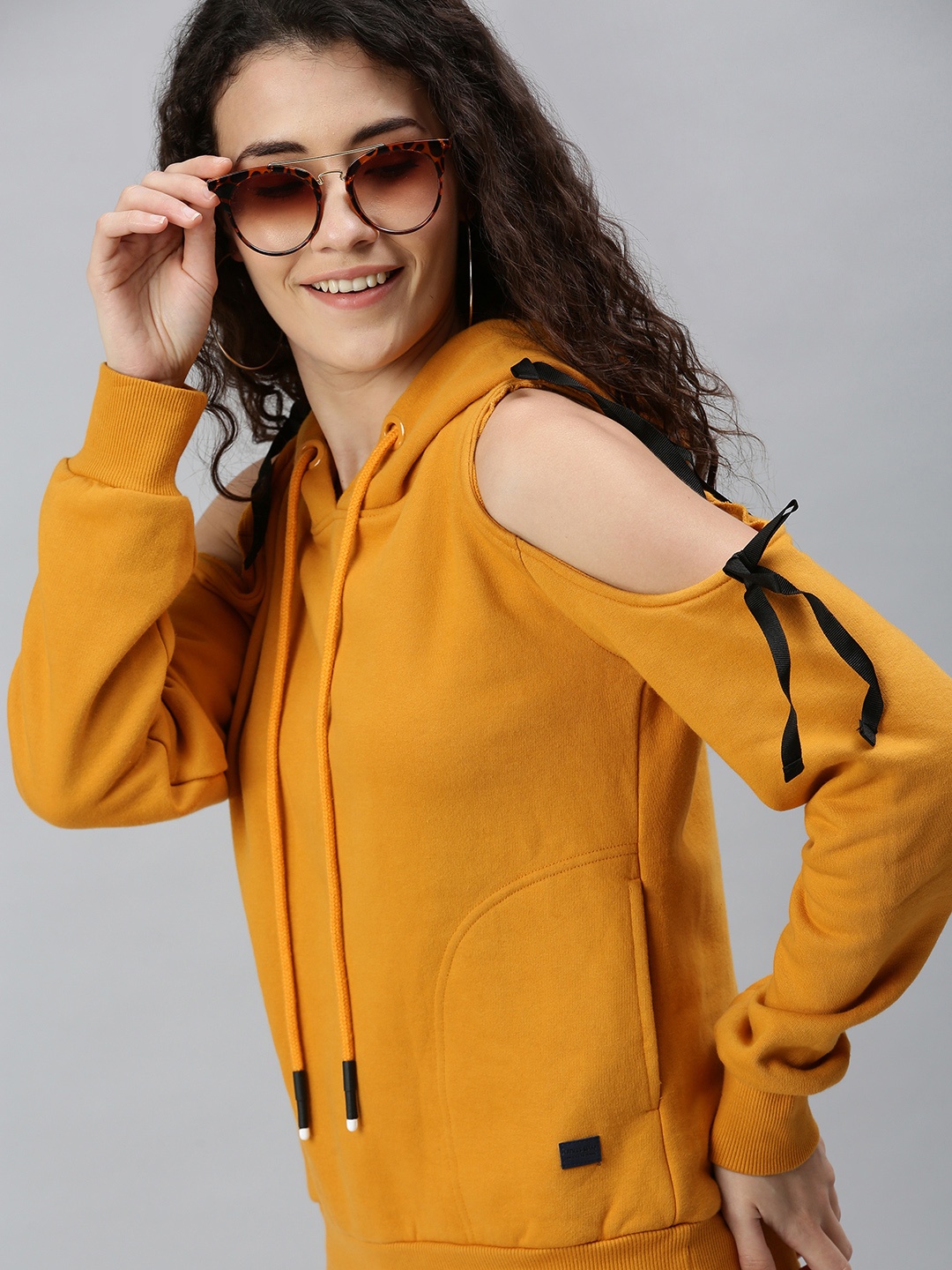 

Campus Sutra Women Mustard Yellow Cold Shoulder Hooded Sweatshirt