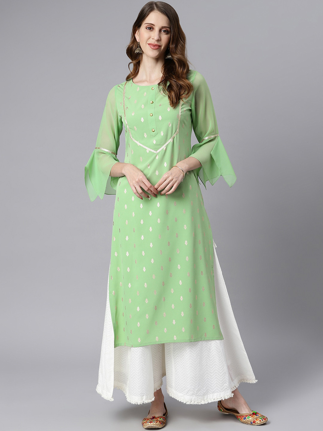 

Janasya Women Green & Gold Ethnic Motifs Bell Sleeves Indie Prints Crepe Kurta