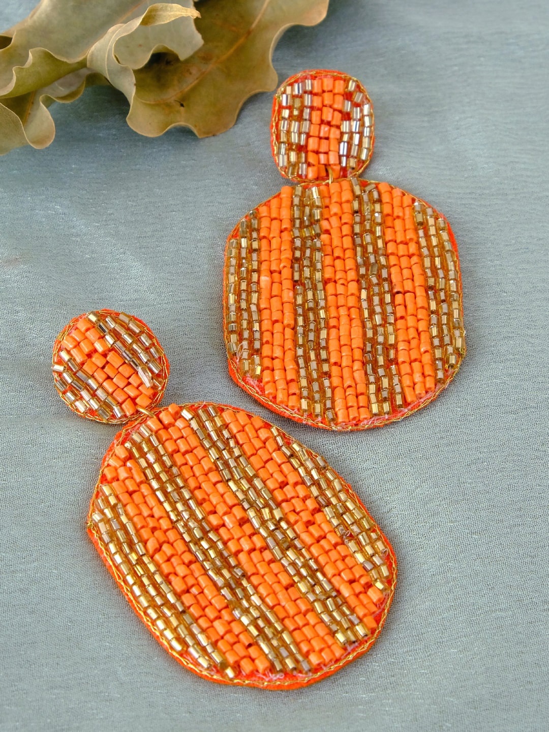 

Crunchy Fashion Boho Beaded Oval Shape Orange & Gold-Toned Contemporary Drop Earrings