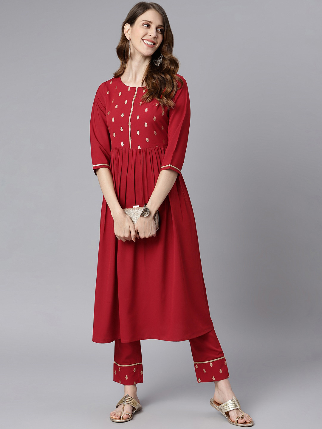 

Janasya Women Red & Golden Ethnic Motifs Yoke Design Pleated Kurta with Trousers