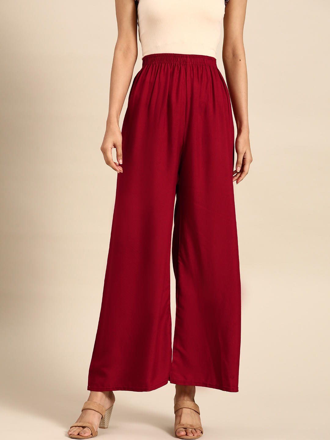 

Saadgi Women Red Solid Straight Ethnic Palazzos