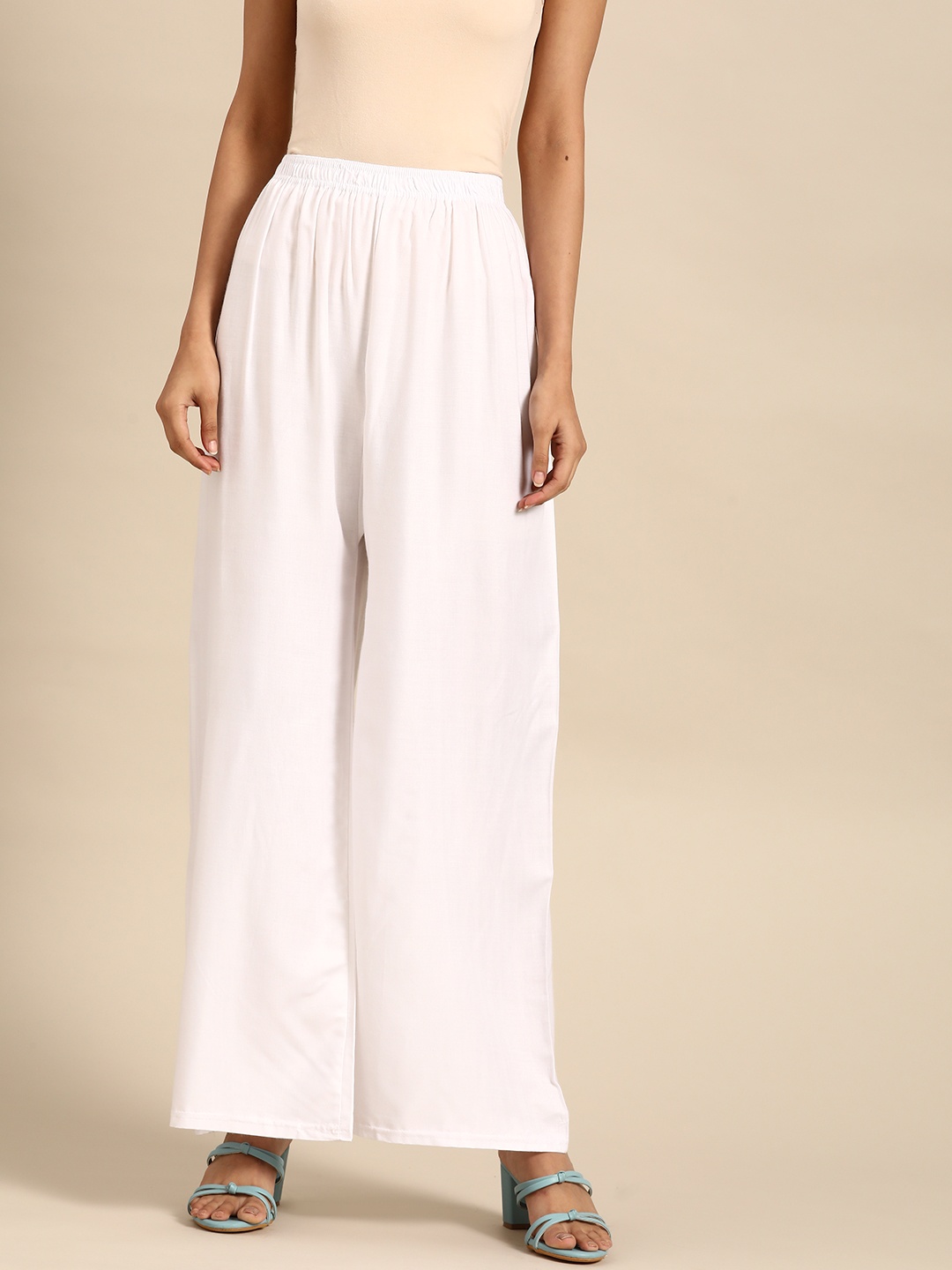 

Saadgi Women White Solid Straight Palazzos