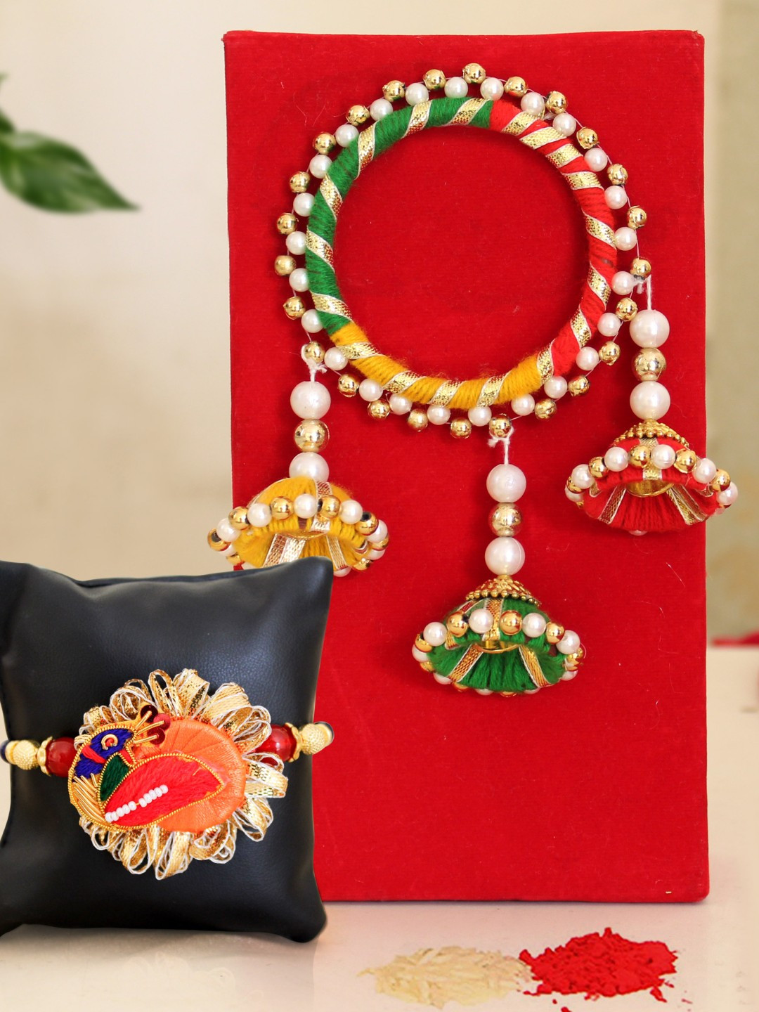 

TIED RIBBONS Multicoloured Rakhi with Card Roli Chawal & Potli Bag Gift Set, Multi