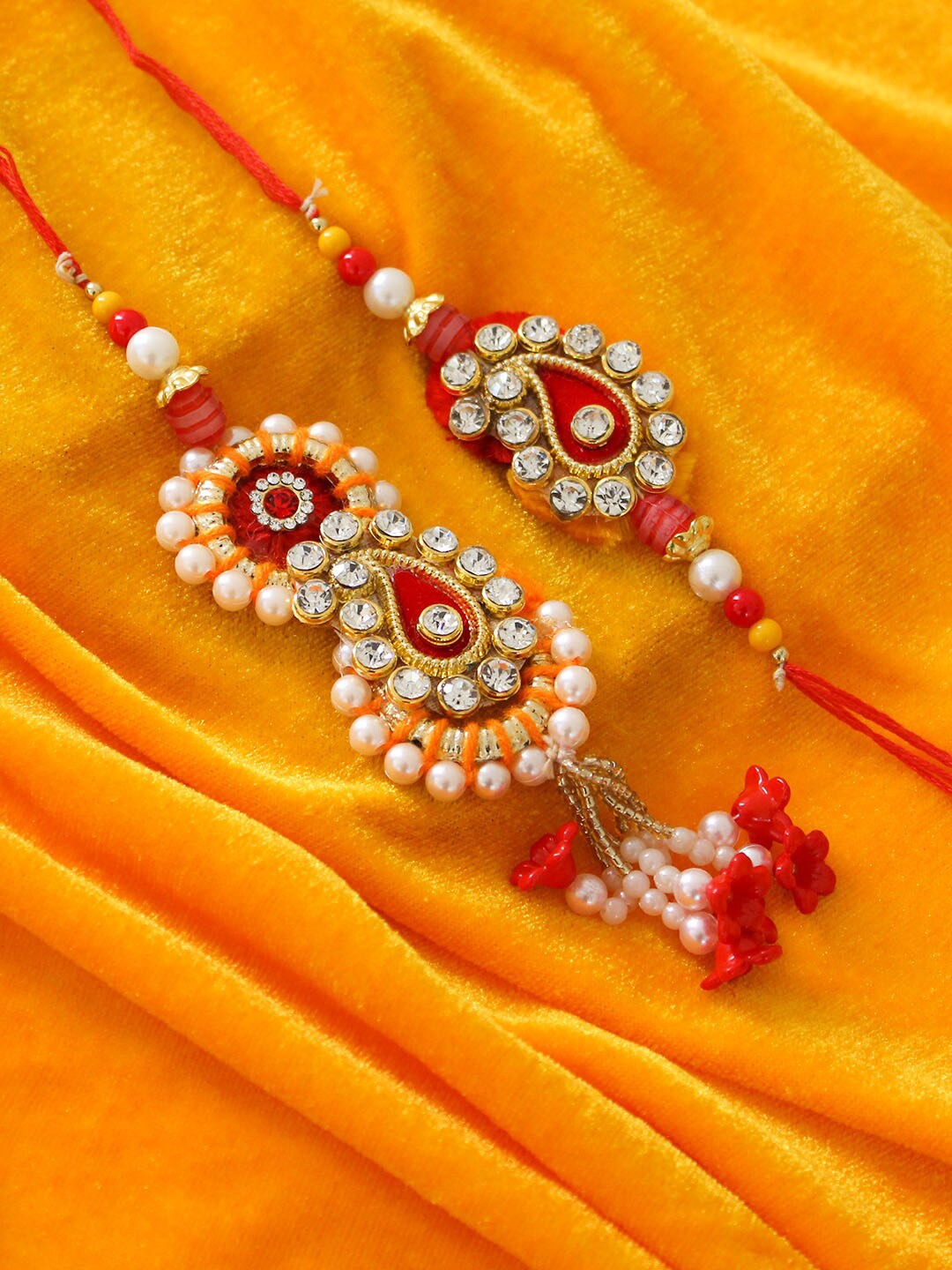 

TIED RIBBONS Multicoloured Bhaiya & Bhabhi Lumba Rakhi Set with Card & Roli Chawal, Multi