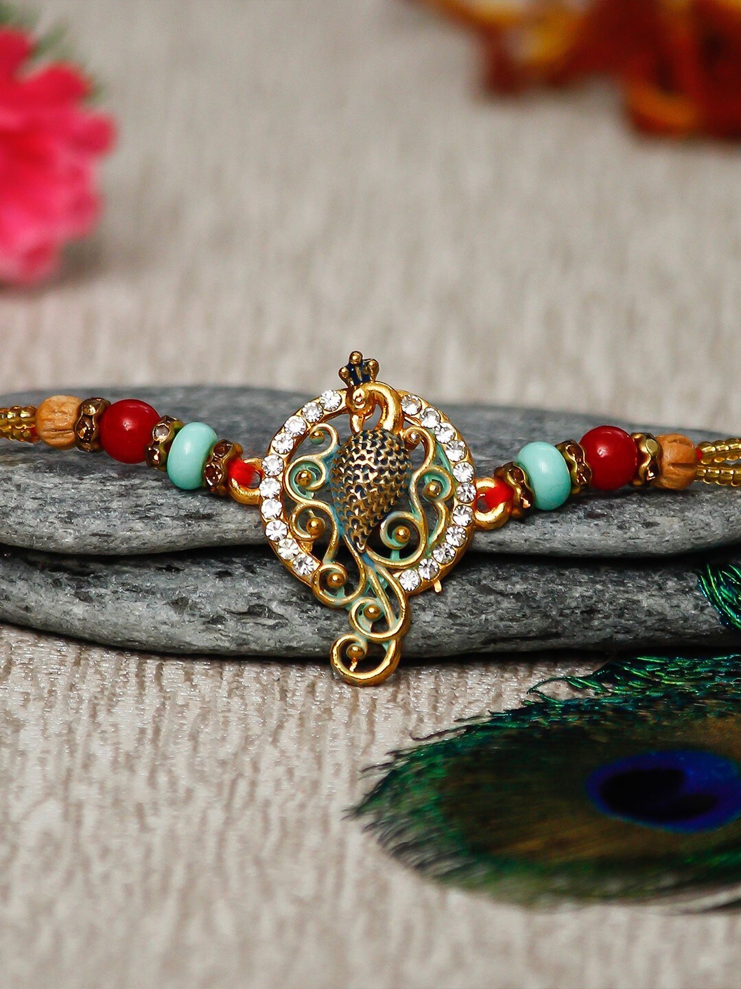 

eCraftIndia Gold-Toned & Red Designer Peocock Rakhi & Roli Chawal Pack