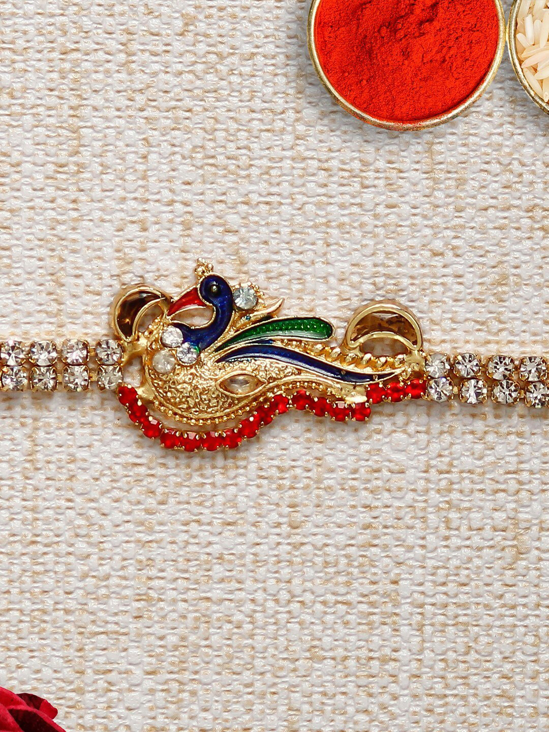 

eCraftIndia Gold-Toned & Red Designer Peocock Rakhi & Roli Chawal Pack