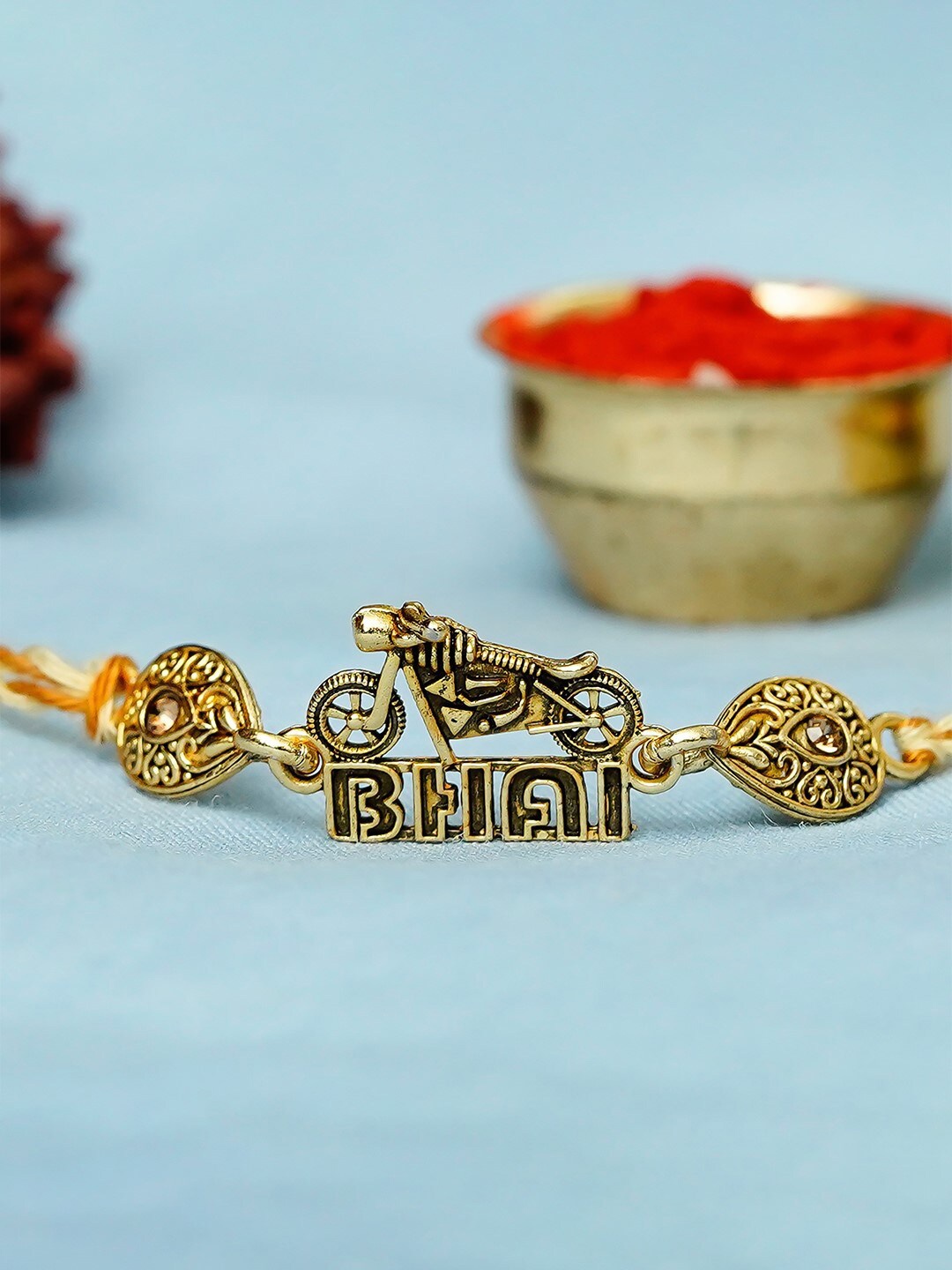 

eCraftIndia eCraftIndia Gold-Toned Designer Bike Rakhi & Roli Chawal Pack