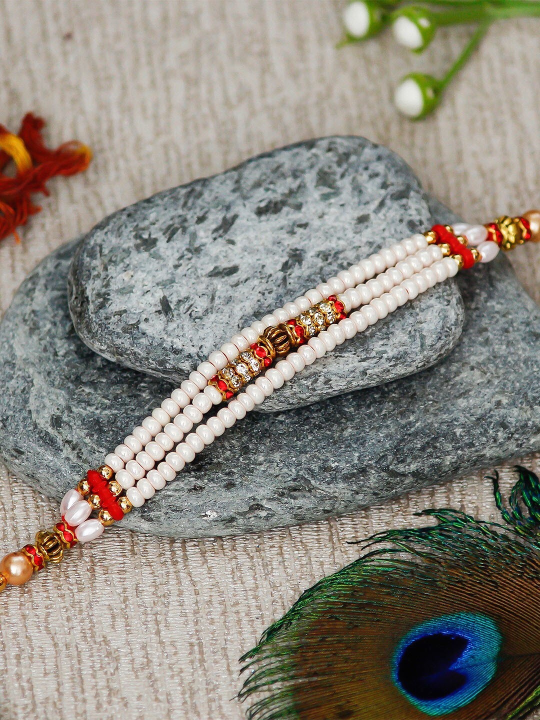 

eCraftIndia White & Red Designer Rakhi & Roli Chawal Pack