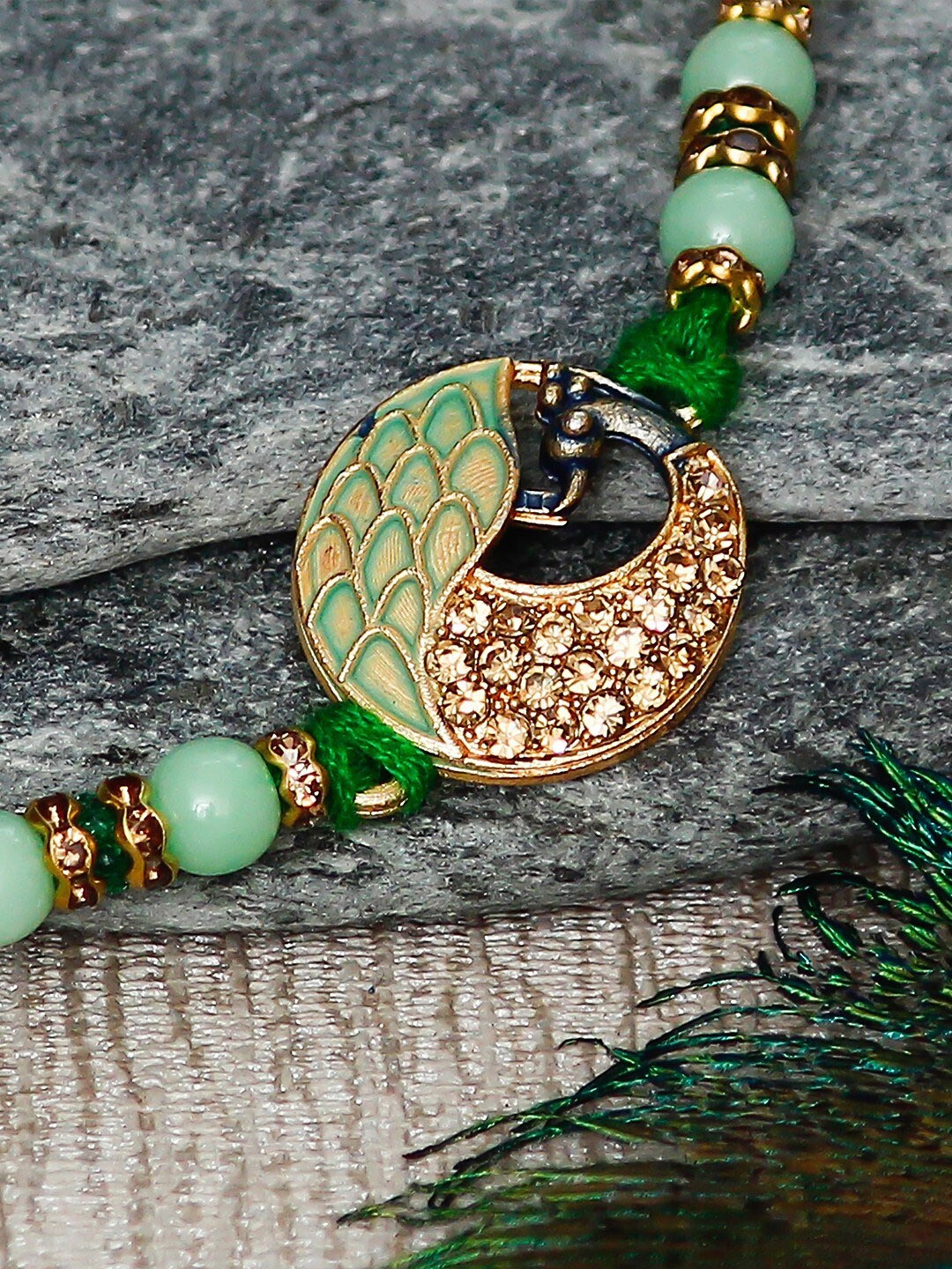 

eCraftIndia Stone-Studded Peacock Rakhi And Roli Chawal Pack, Gold