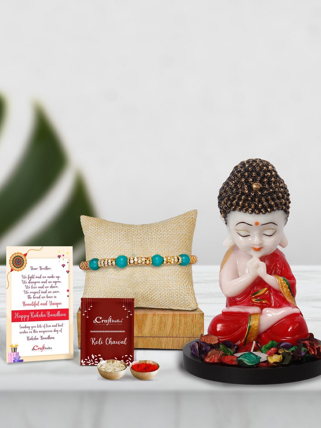 

eCraftIndia Pearl Rakhi With Monk Buddha Statue, Petals & Tealight & Roli Chawal, Card, Green