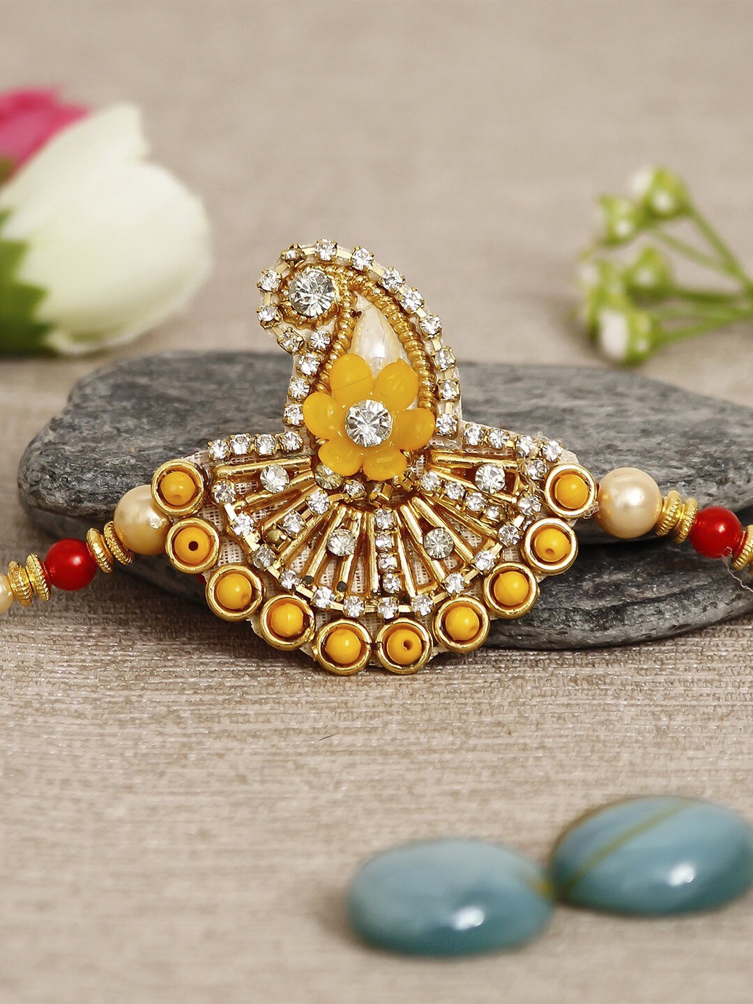 

eCraftIndia Stone-Studded Rakhi, Yellow