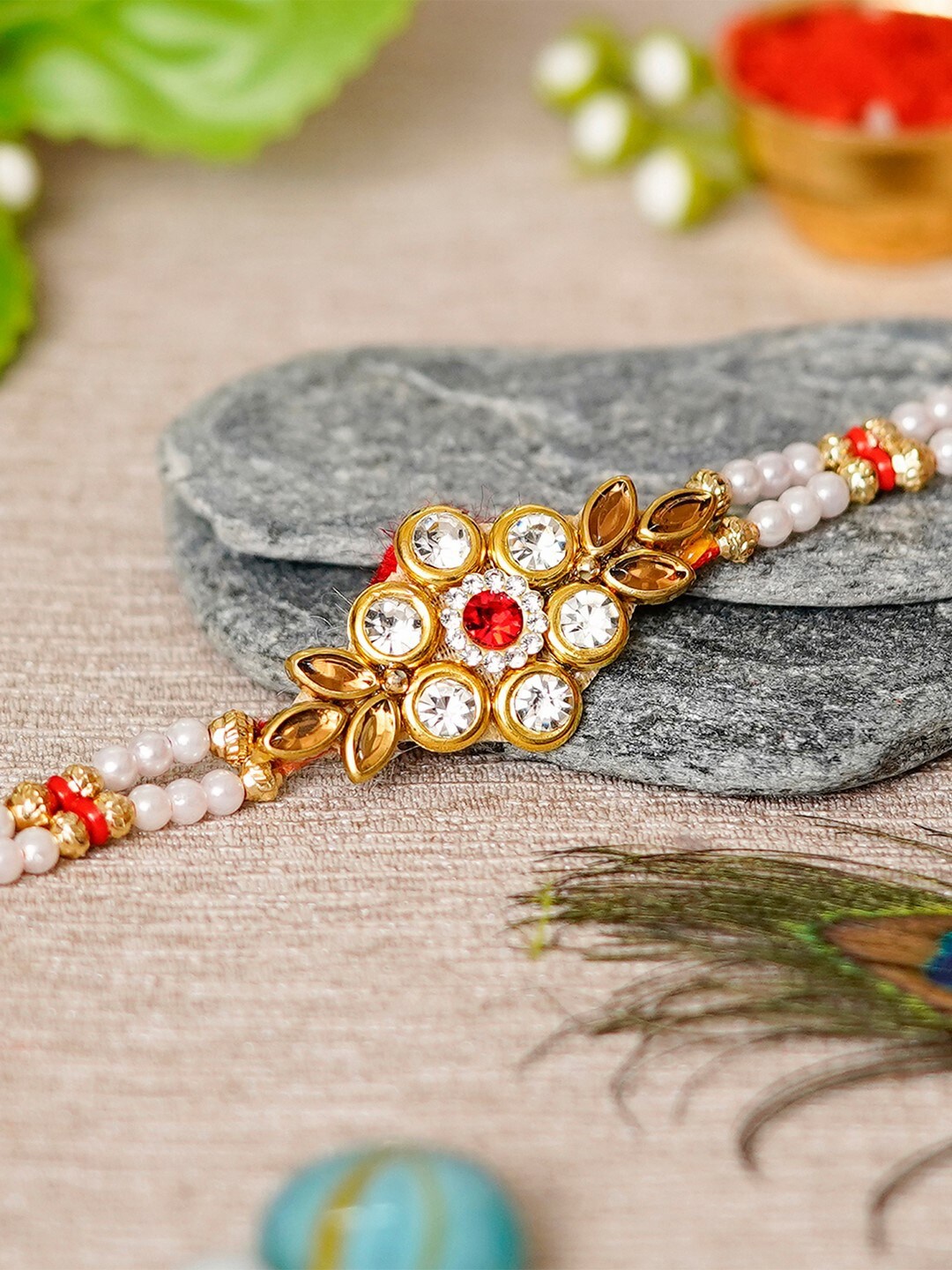 

eCraftIndia Designer Gold-Toned & Red Handcrafted Rakhi & Roli Chawal Pack