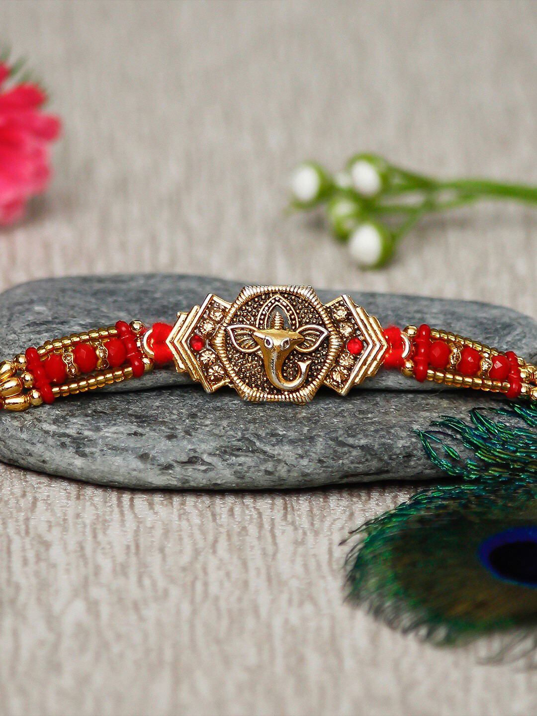 

eCraftIndia Gold-Toned & Red Beaded Ganesha Rakhi