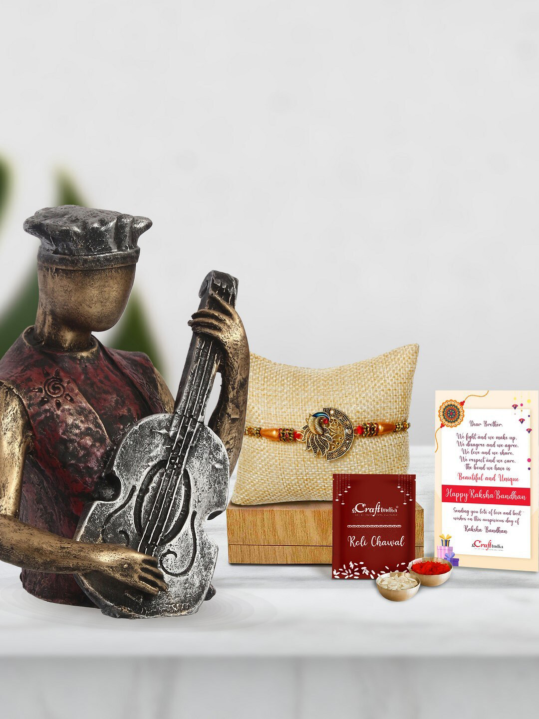

eCraftIndia Multicoloured Peocock Rakhi With Man Playing Guitar Statue Gift Set, Multi