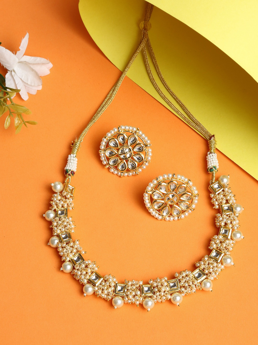 

Ruby Raang Women Gold-Plated & White Kundan & Pearl Beaded Handcrafted Jewellery Set