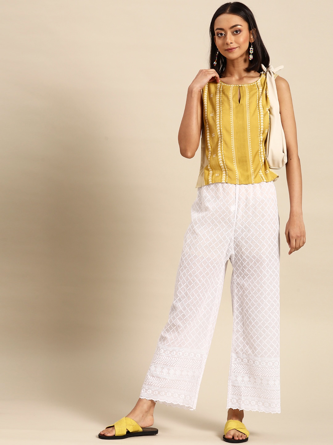 

Saadgi Women White Ethnic Motifs Embroidered Palazzos