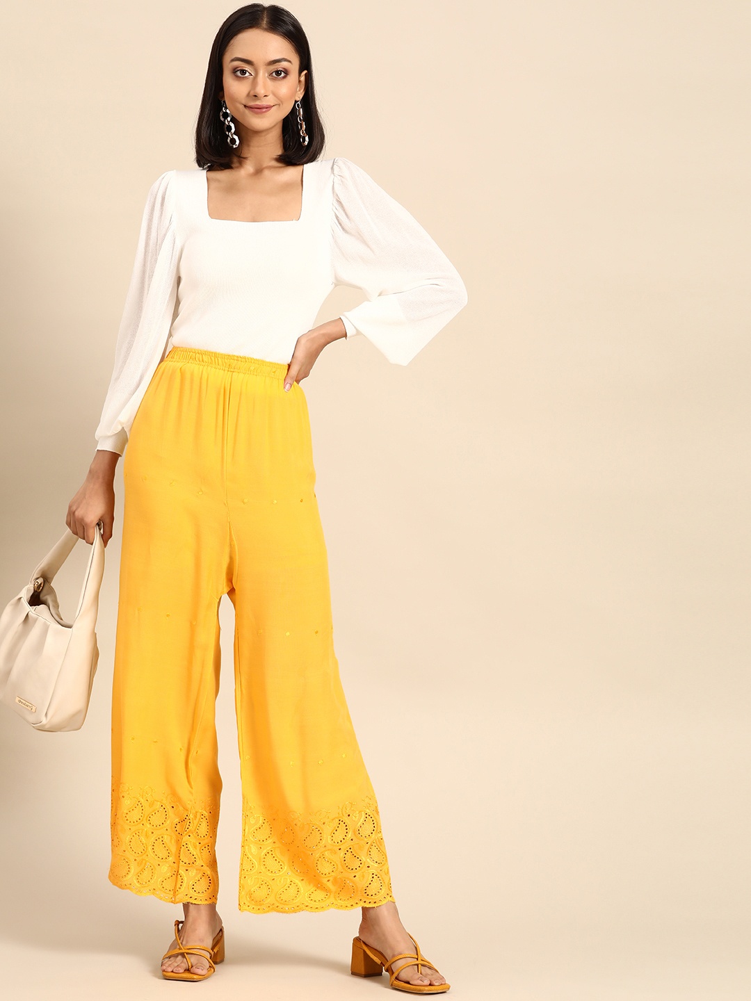

Saadgi Women Yellow Ethnic Motifs Embroidered Palazzos