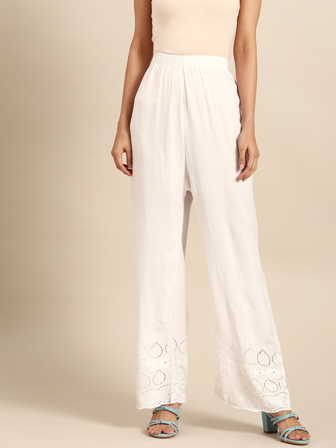

Saadgi Women White Ethnic Motifs Embroidered Palazzos