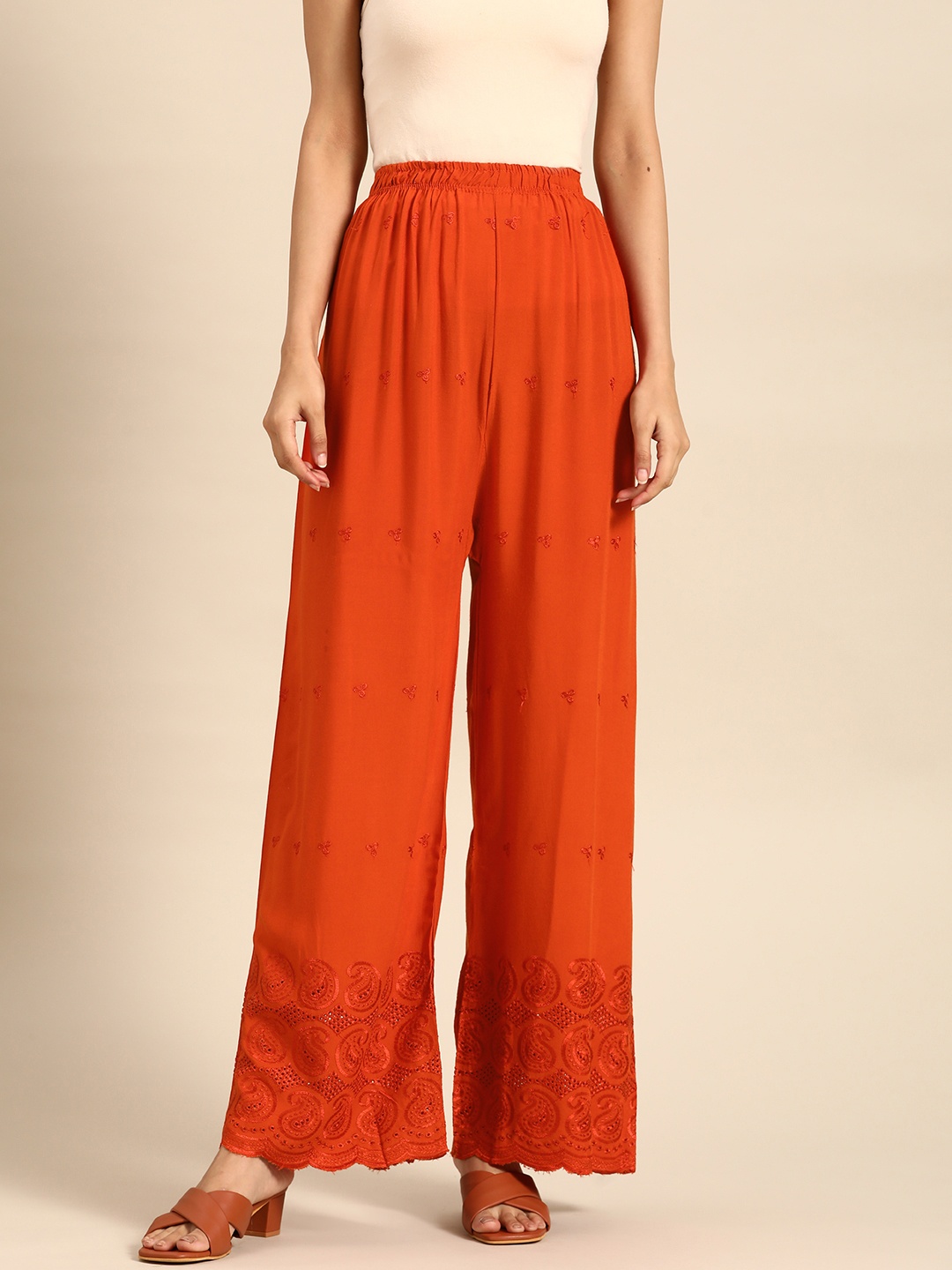 

Saadgi Women Rust Orange Chikankari Embroidered Palazzos