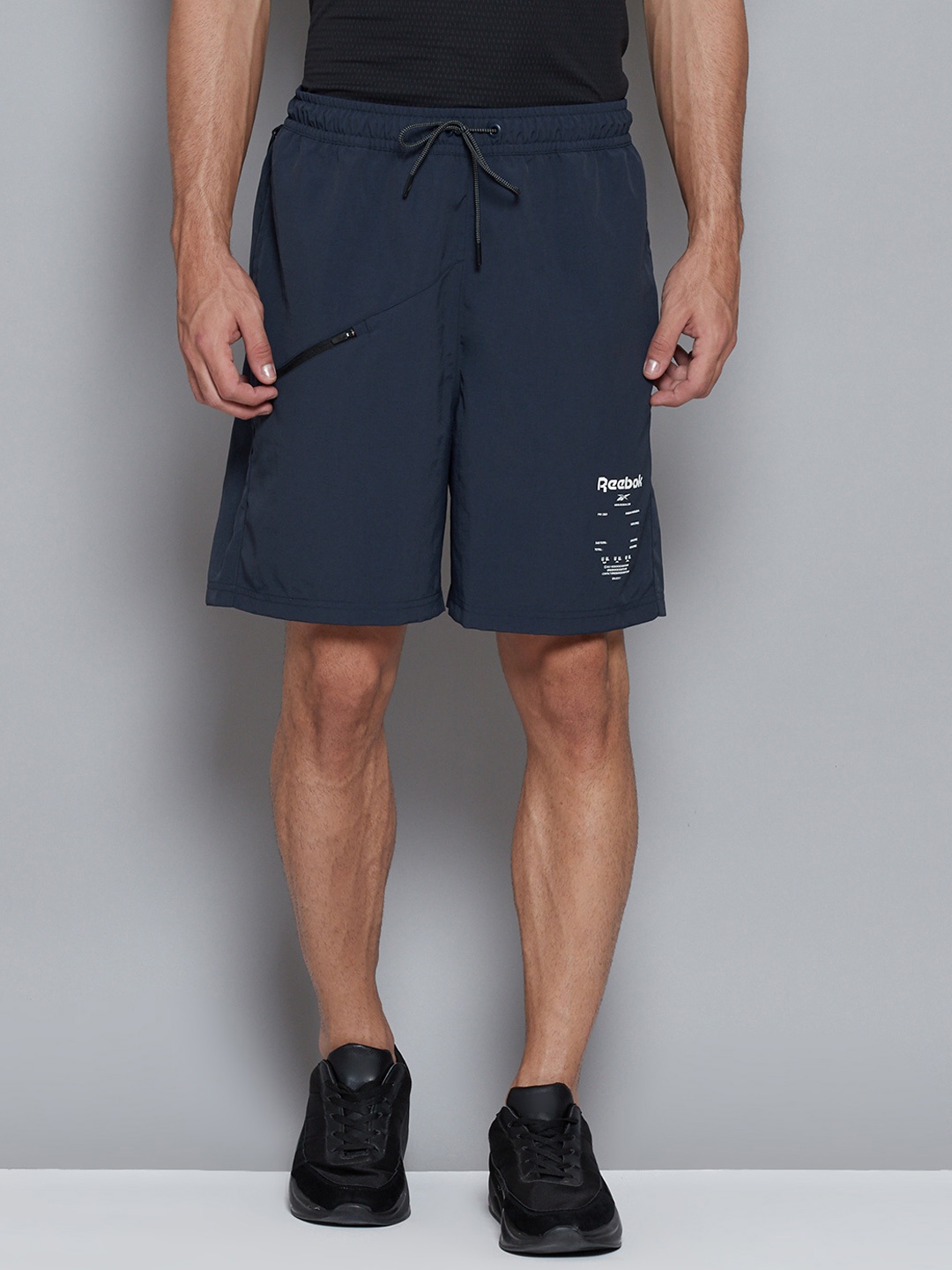 

Reebok Men Navy Road Trip Woven Training Shorts, Navy blue