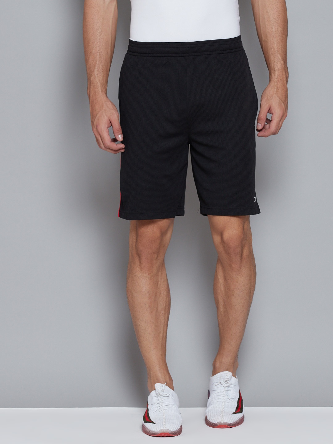 

Reebok Men Black Solid Mid-Rise Training or Gym Sports Shorts