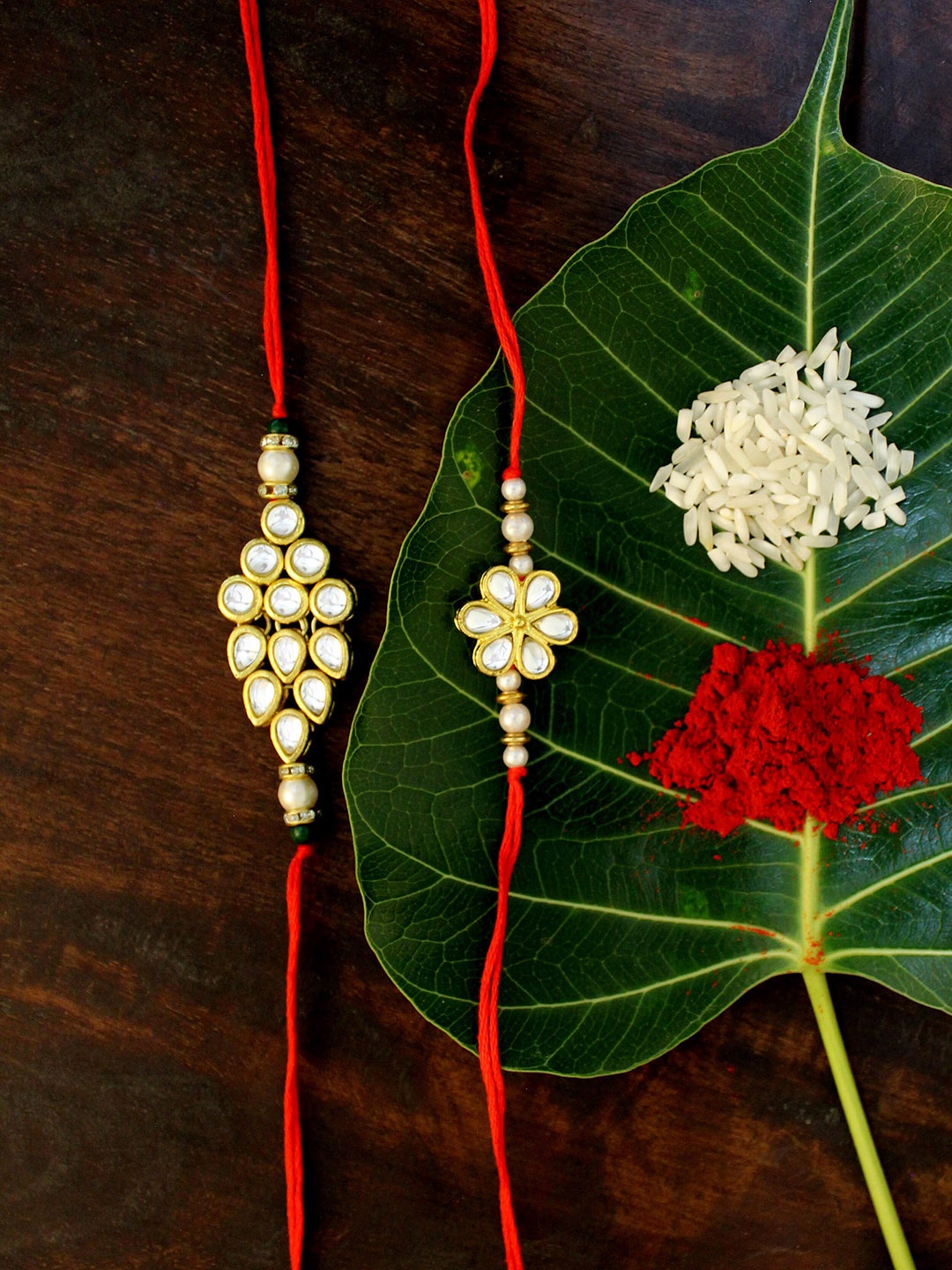 

KARATCART Set of 2 Gold-Plated & Red Kundan Rakhis