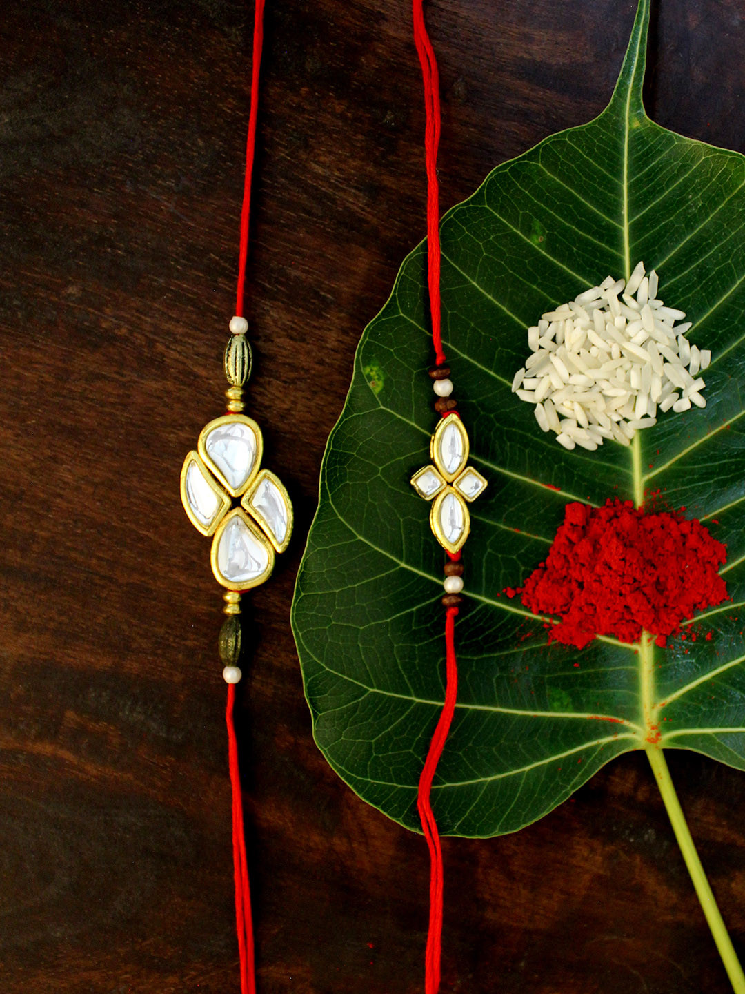 

KARATCART Set of 2 Gold-Plated & Red Kundan Rakhi