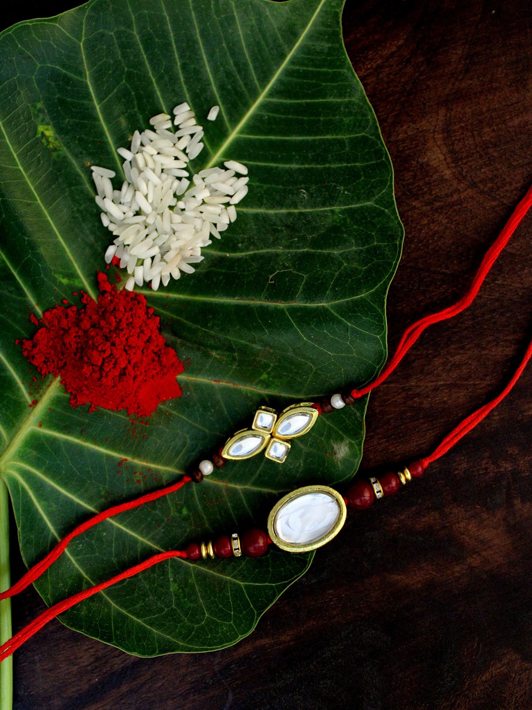 

KARATCART Set of 2 Gold-Plated & Red Kundan Rakhi