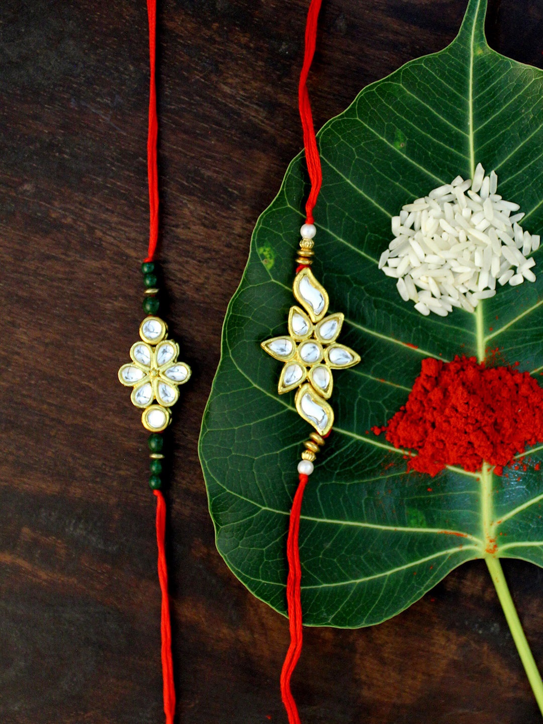 

KARATCART Set of 2 Gold-Plated & Red Kundan Rakhi