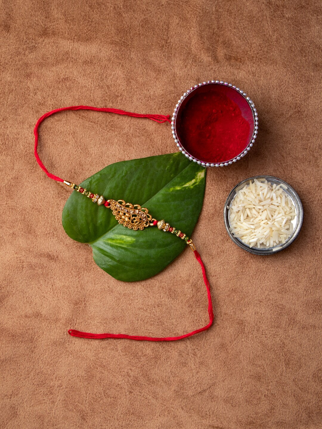 

MORKANTH JEWELLERY Gold-Toned & Red Brass Handcrafted Rakhi