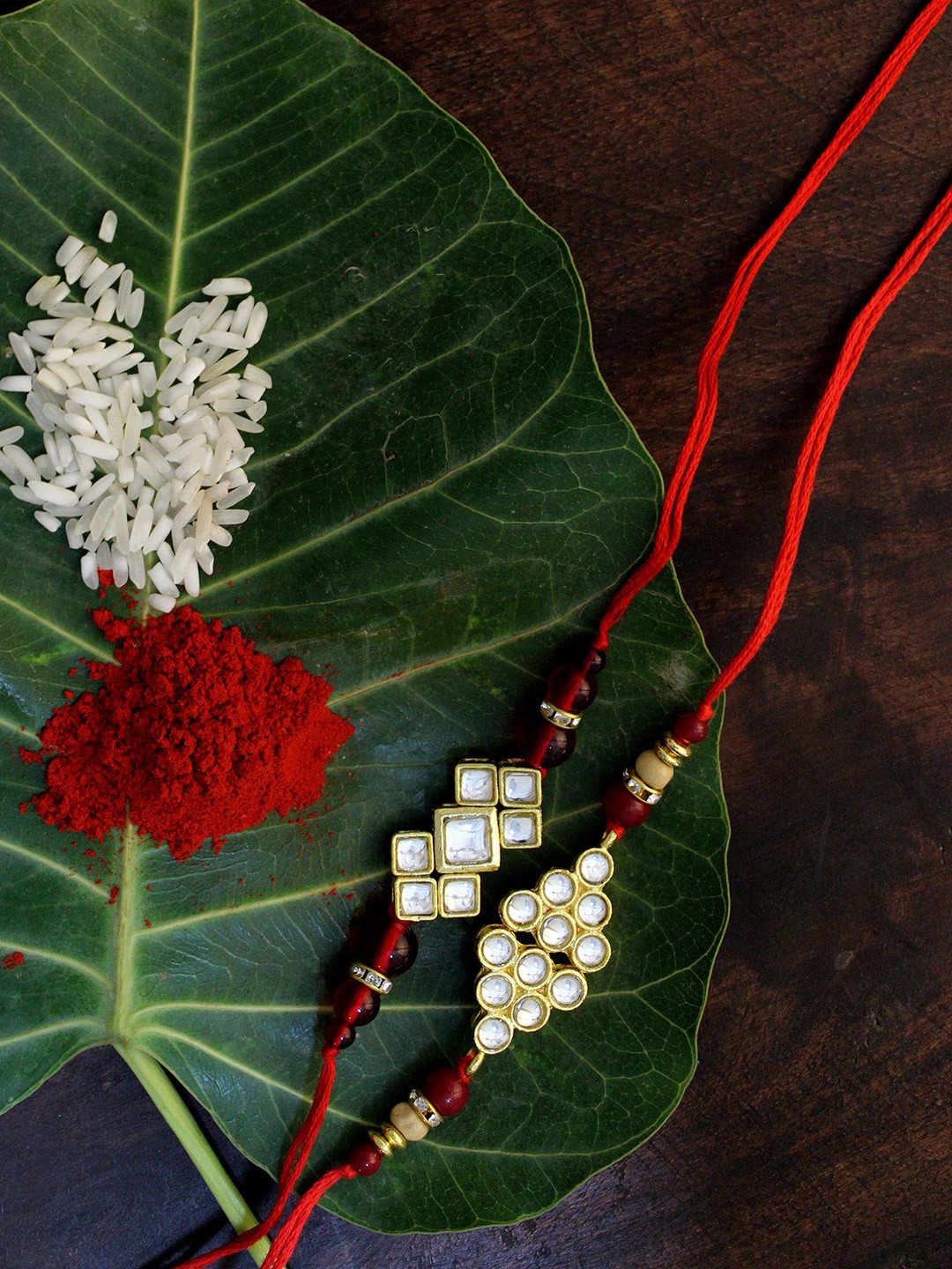 

KARATCART Set of 2 Gold-Plated & Red Kundan Rakhi