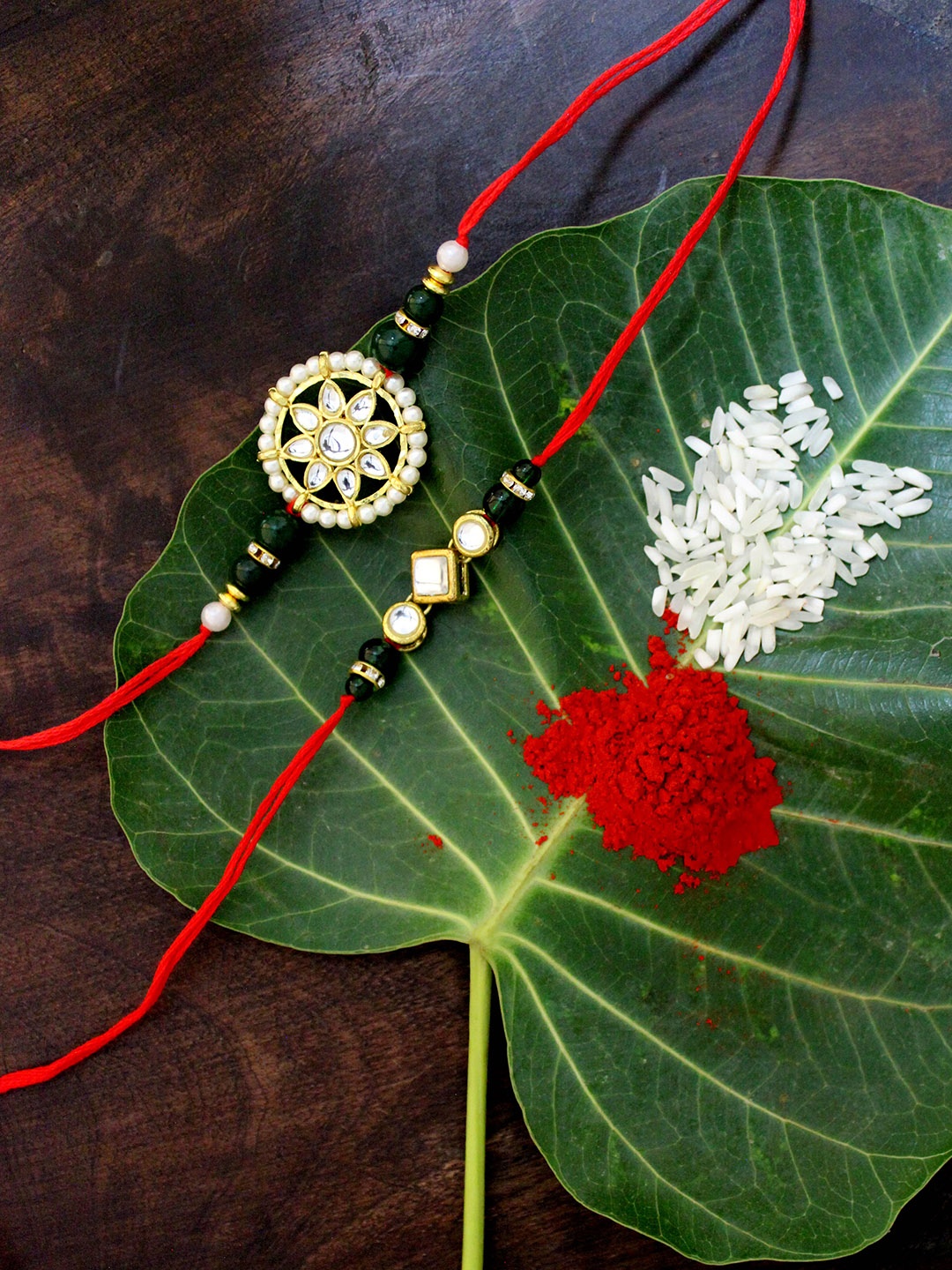 

KARATCART Set of 2 Gold-Plated & Red Kundan Rakhi