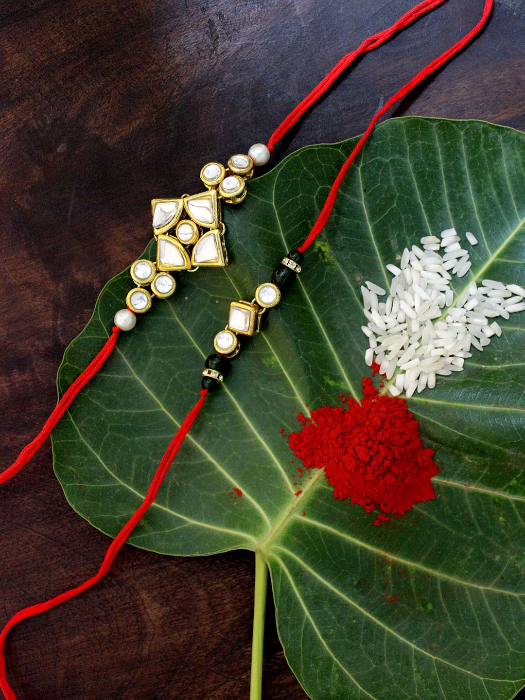 

KARATCART Set of 2 Gold-Plated & Red Kundan Rakhi