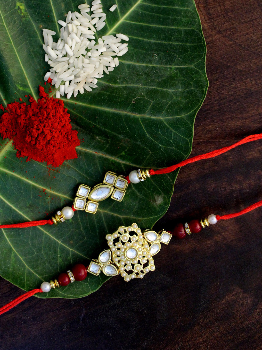 

KARATCART Set of 2 Gold-Plated & Red Kundan Rakhi