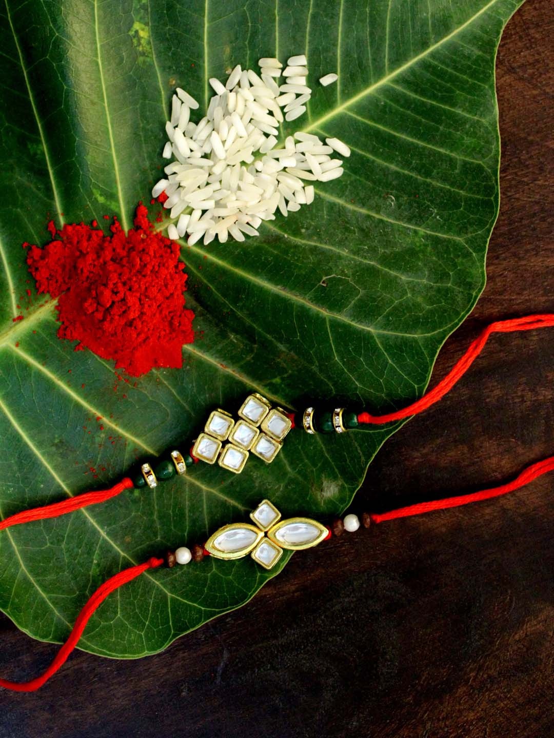

KARATCART Set of 2 Gold-Plated & Red Kundan Rakhi