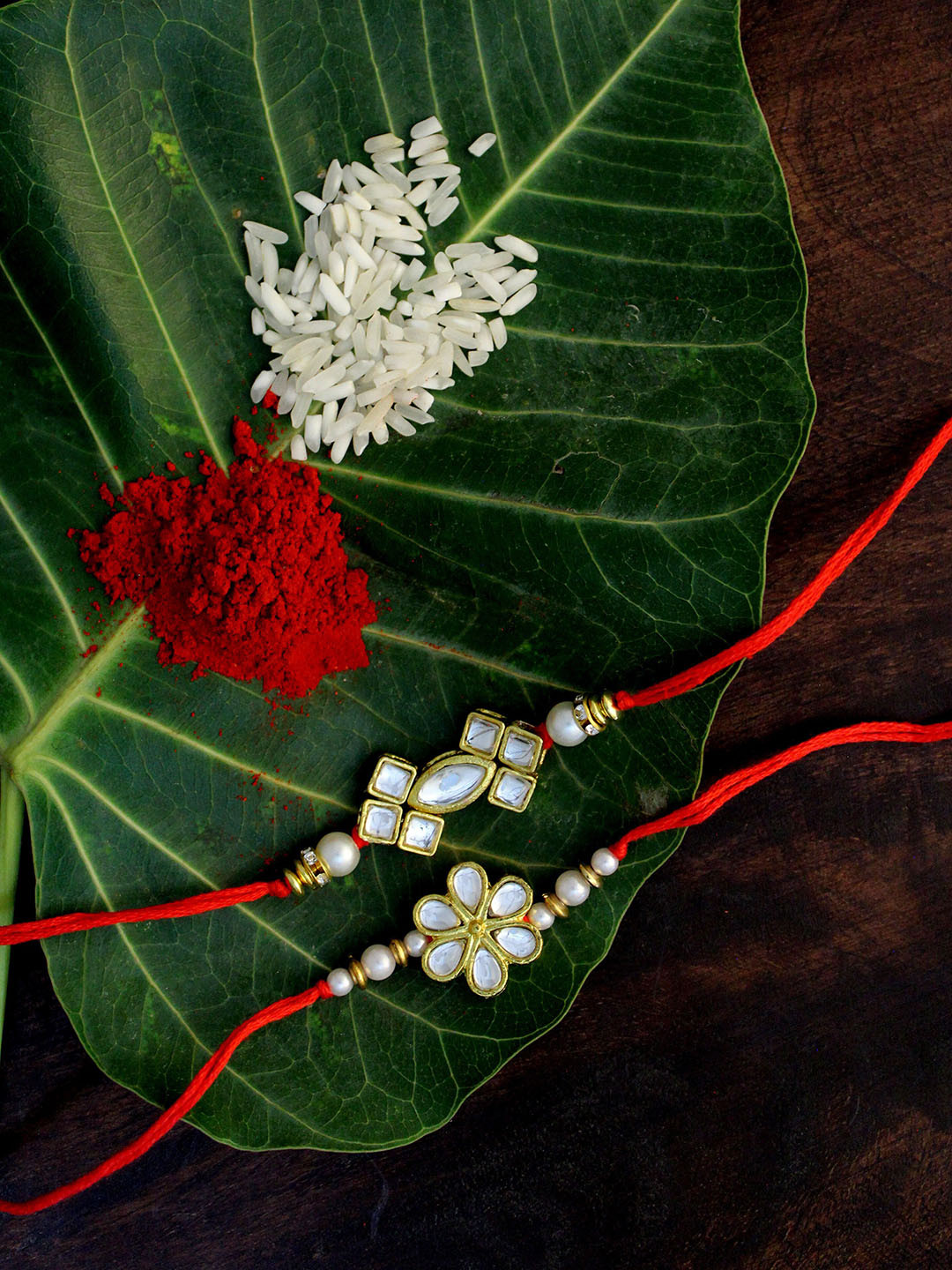 

KARATCART Set of 2 Gold-Plated & Red Kundan Rakhi