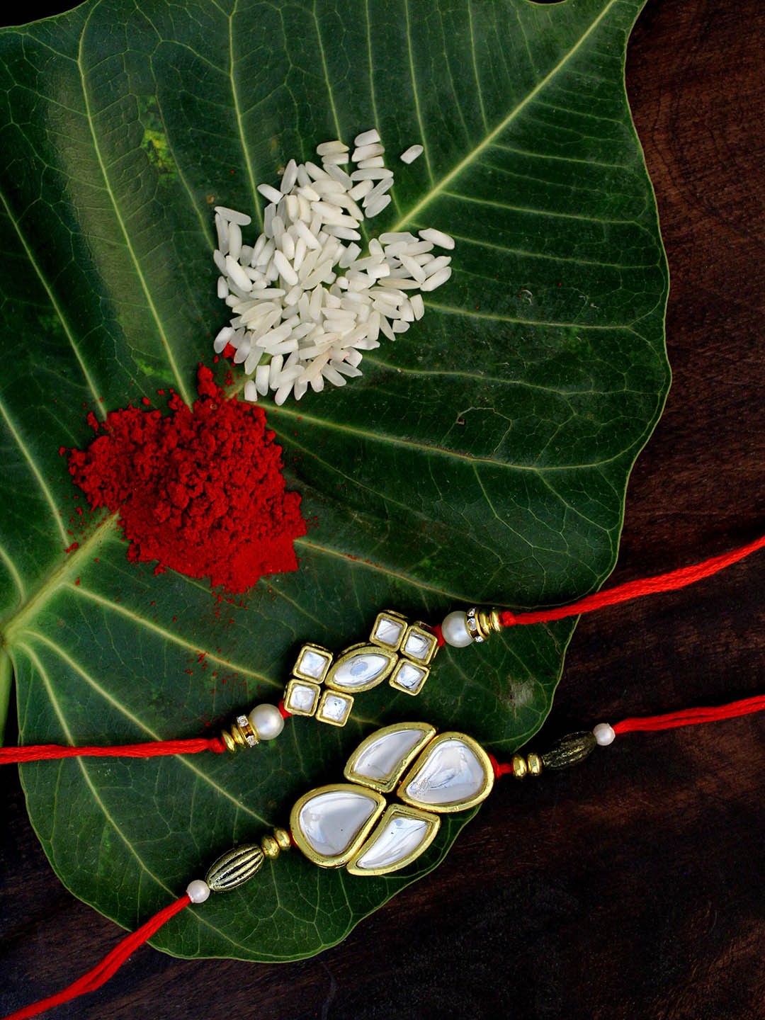 

KARATCART Set of 2 Gold-Plated & Red Kundan Rakhi