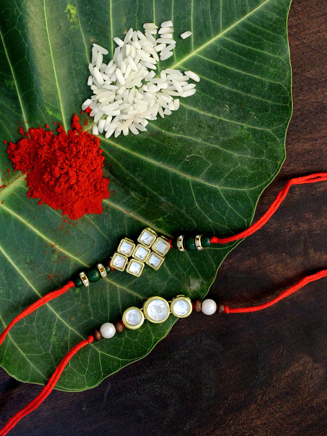 

KARATCART Set of 2 Gold-Plated & Red Kundan Rakhi