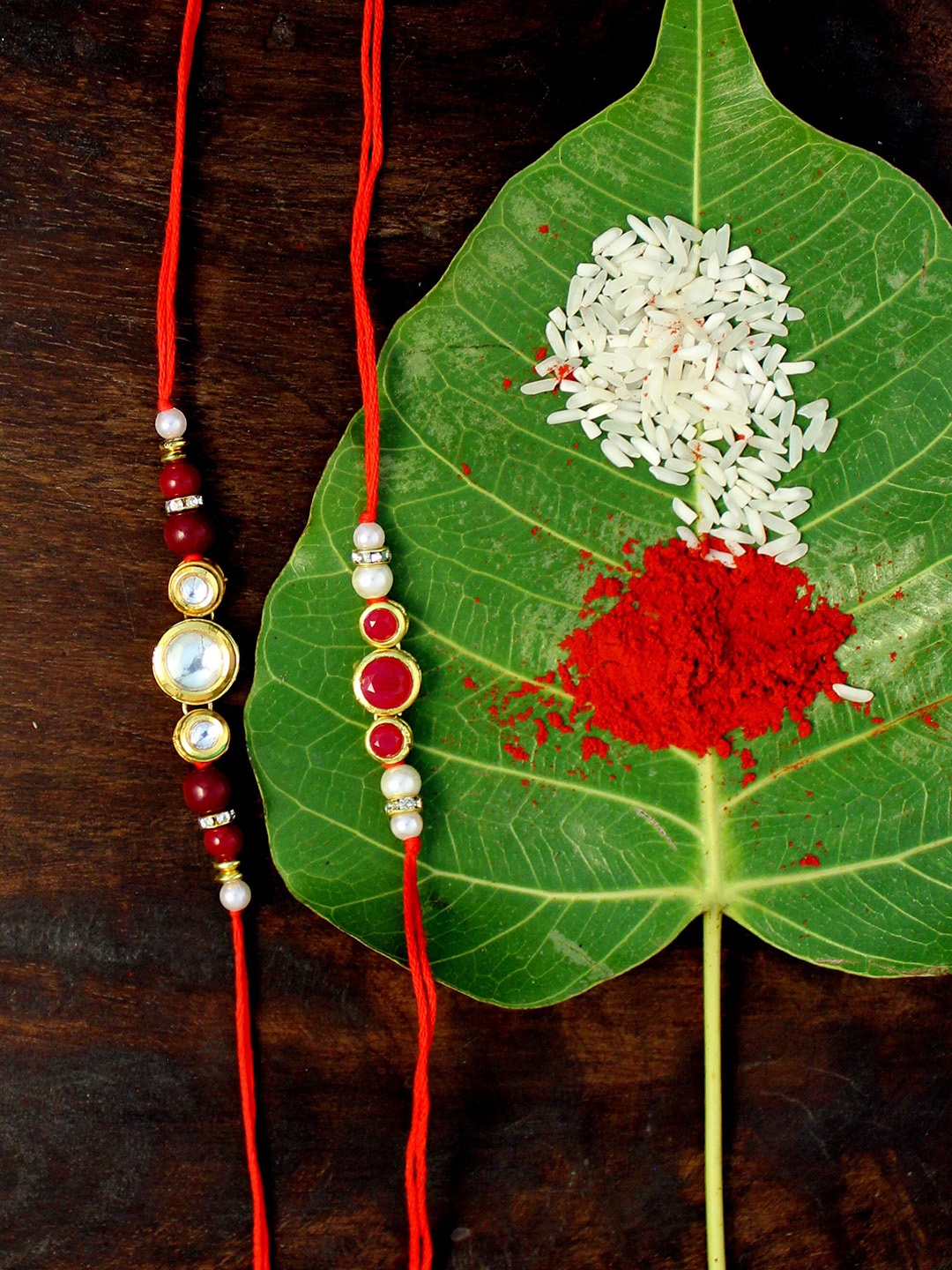 

KARATCART Set of 2 Gold-Plated & Red Kundan Rakhis