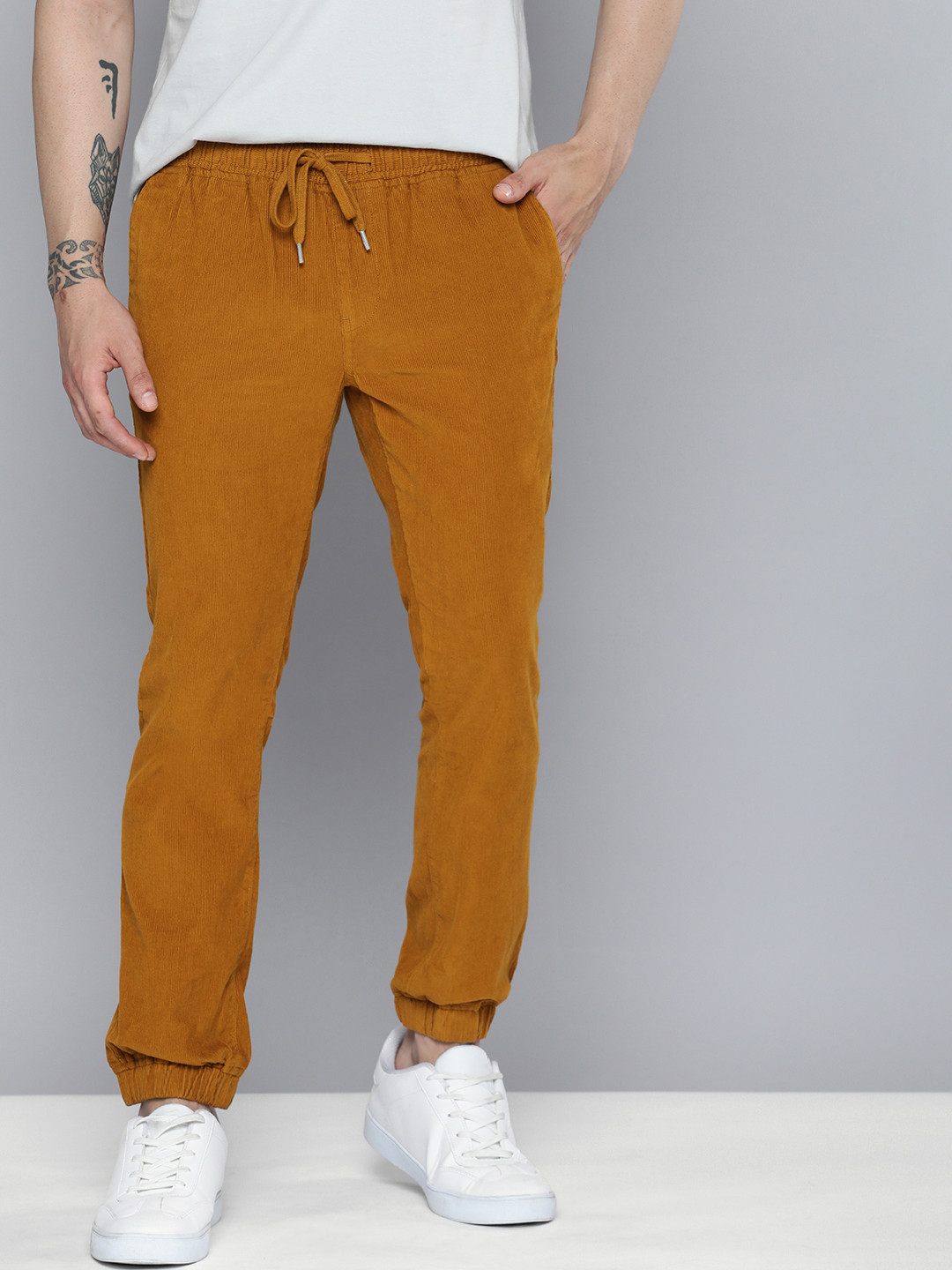 

Mast & Harbour Men Pure Cotton Velvet Finish Solid Corduroy Joggers, Brown